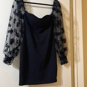 black mini heart shaped neckline with puffed sleeves. never worn